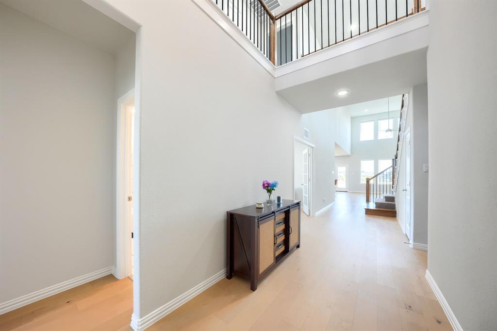 1309 Buttercup Road Prosper, TX 75078 - Photo 3 of 36 a view of a hallway with seating area