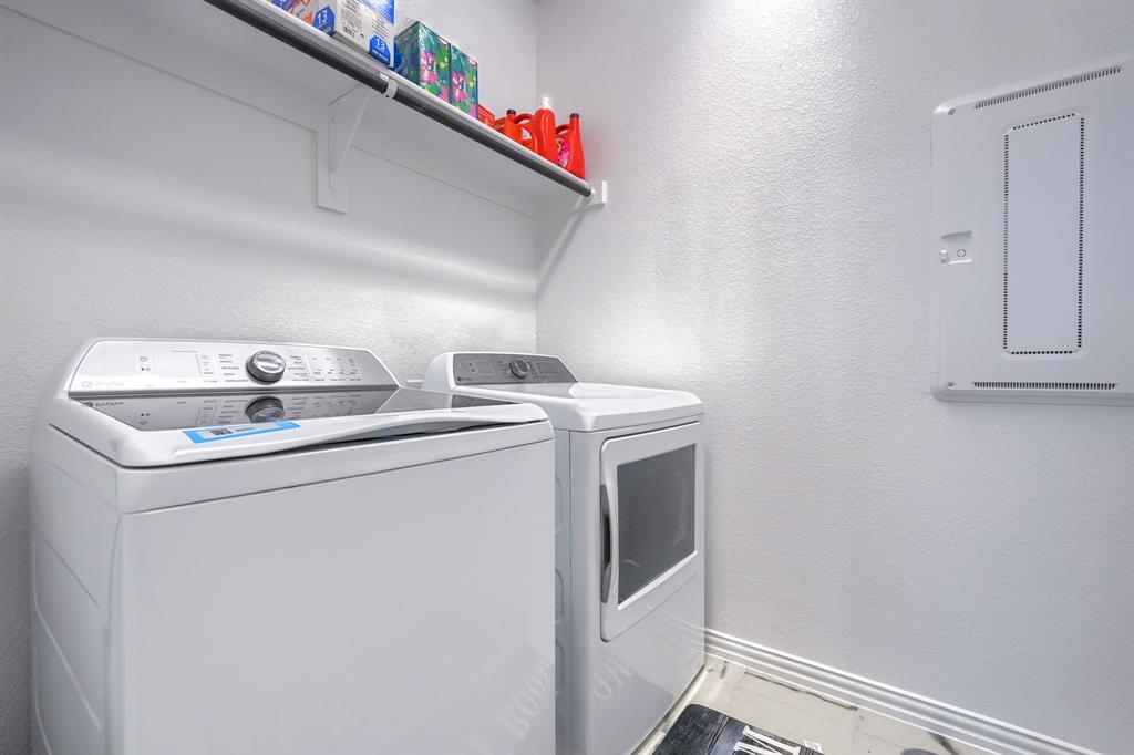 1309 Buttercup Road Prosper, TX 75078 - Photo 33 of 36 a utility room with dryer and washer