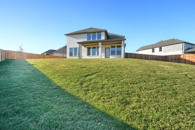 a view of outdoor space with playground and green space