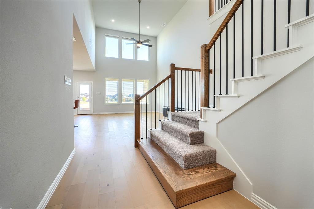 1309 Buttercup Road Prosper, TX 75078 - Photo 8 of 36 a view of entryway and hall with wooden floor
