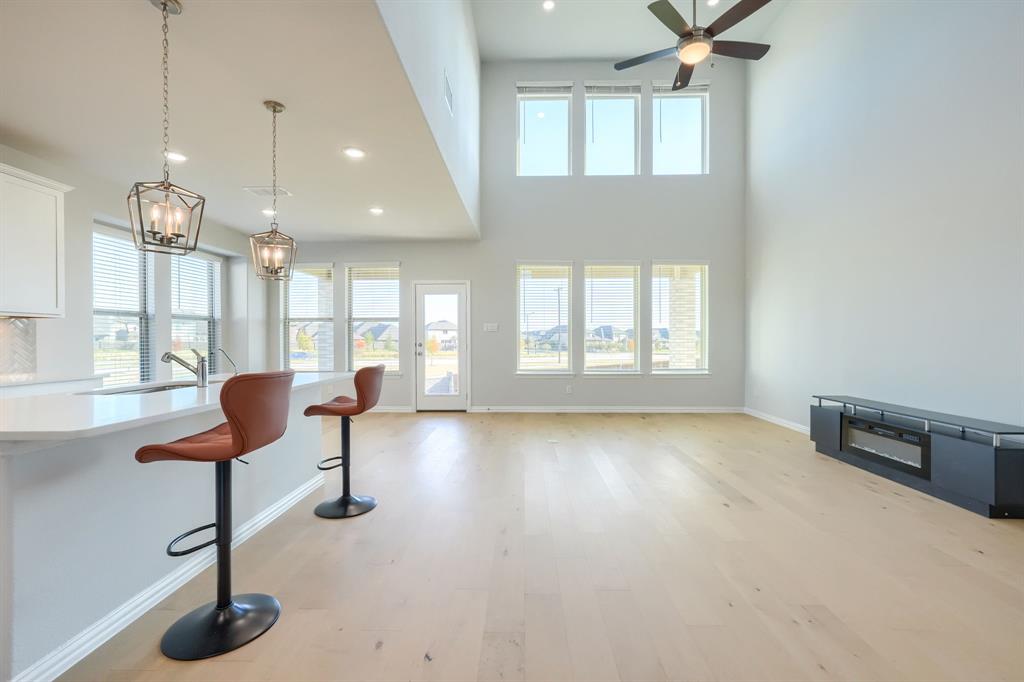 1309 Buttercup Road Prosper, TX 75078 - Photo 9 of 36 a view of a livingroom with furniture and a window