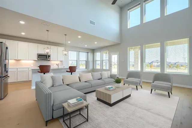 a living room with furniture and a large window