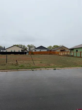 a view of a lake with houses in background