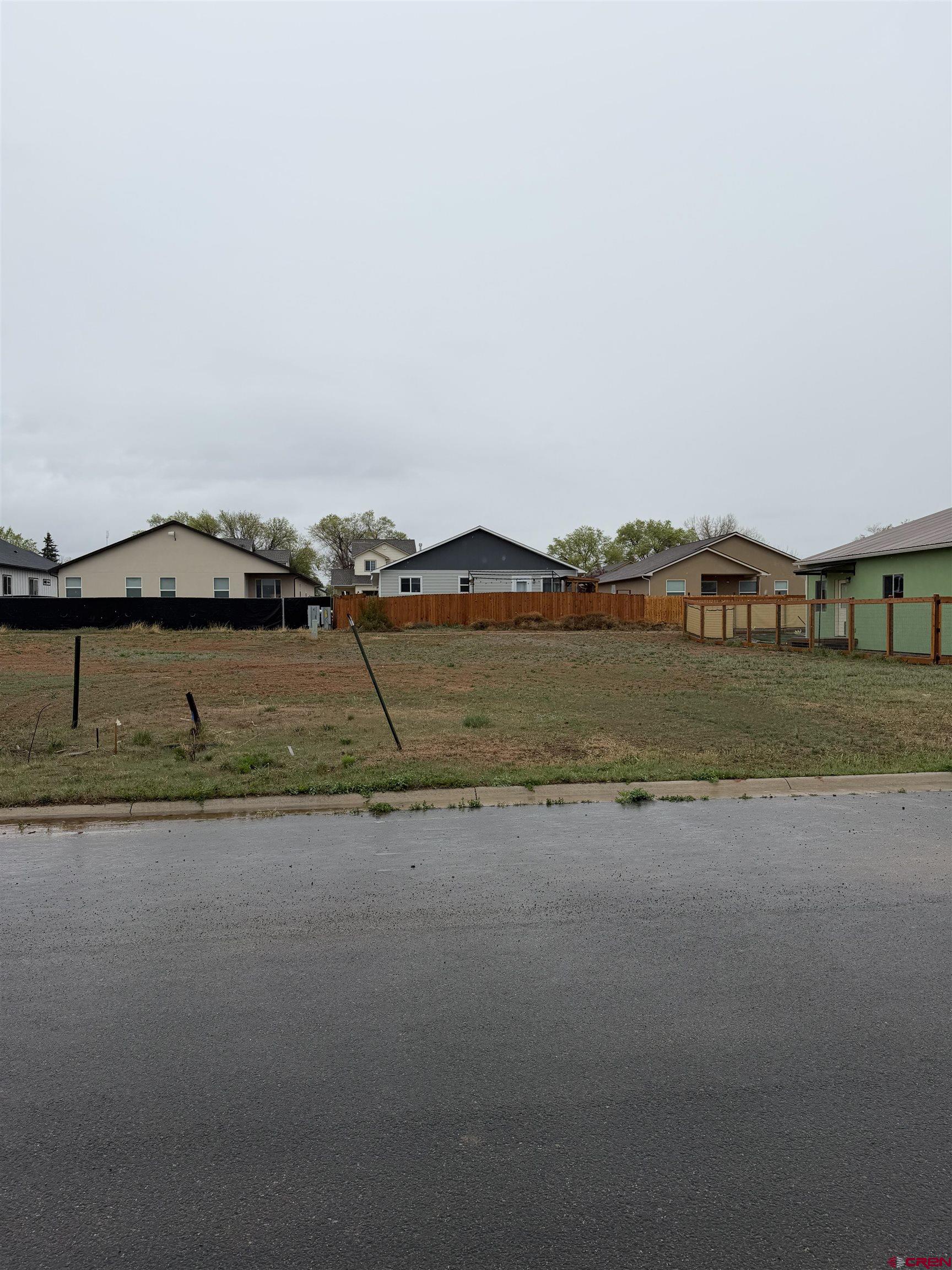 502 Jarrett Avenue Cortez, CO 81321 - Photo 1 of 2 a view of a lake with houses in background