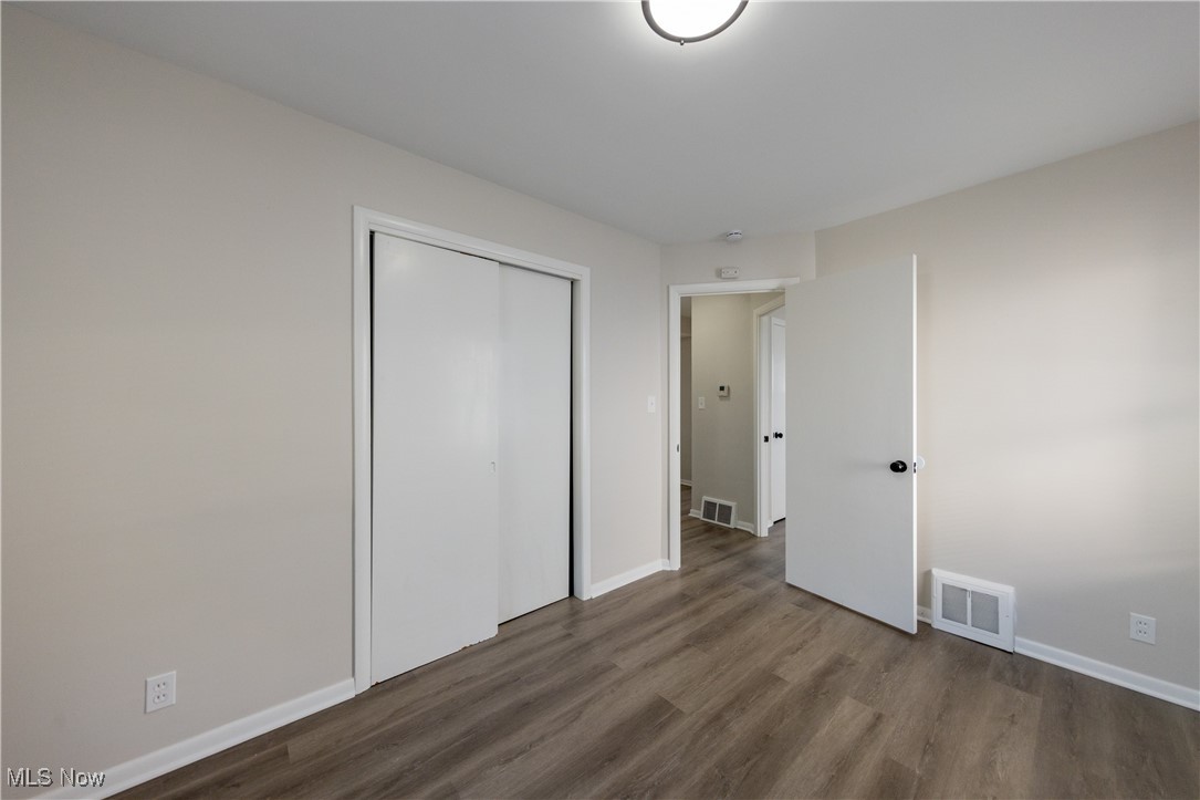 29103 Barjode Road Eastlake, OH 44095 - Photo 7 of 31 Unfurnished bedroom featuring wood finished floors and a closet
