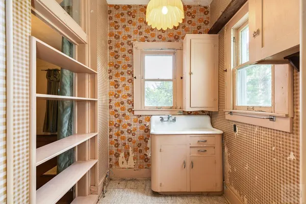 a bathroom with a sink a mirror and a bathtub