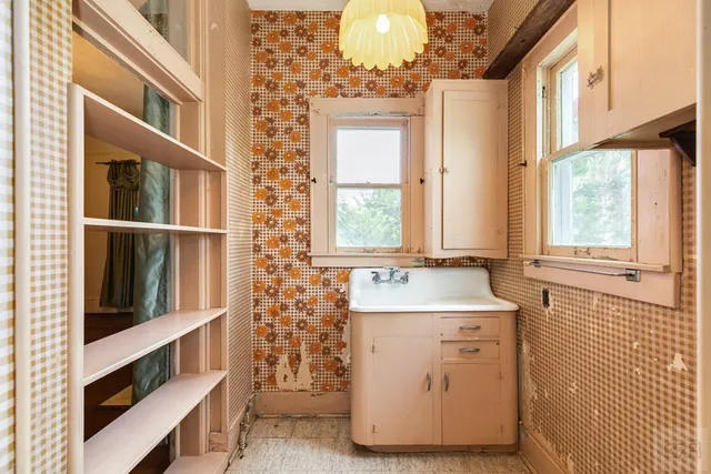 a bathroom with a sink a mirror and a bathtub