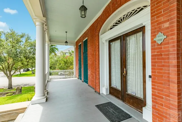 a view of a room with wooden floor and staircase
