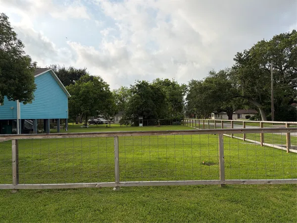 a view of a big yard with a swimming pool