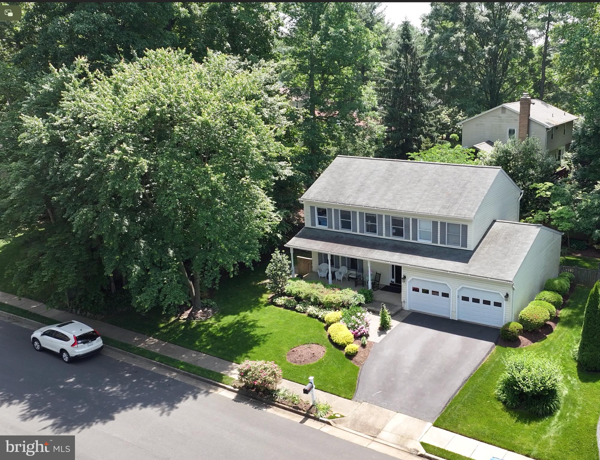 12021 Heather Down Drive Herndon, VA 20170 - Photo 1 of 47 an aerial view of a house with garden space and street view
