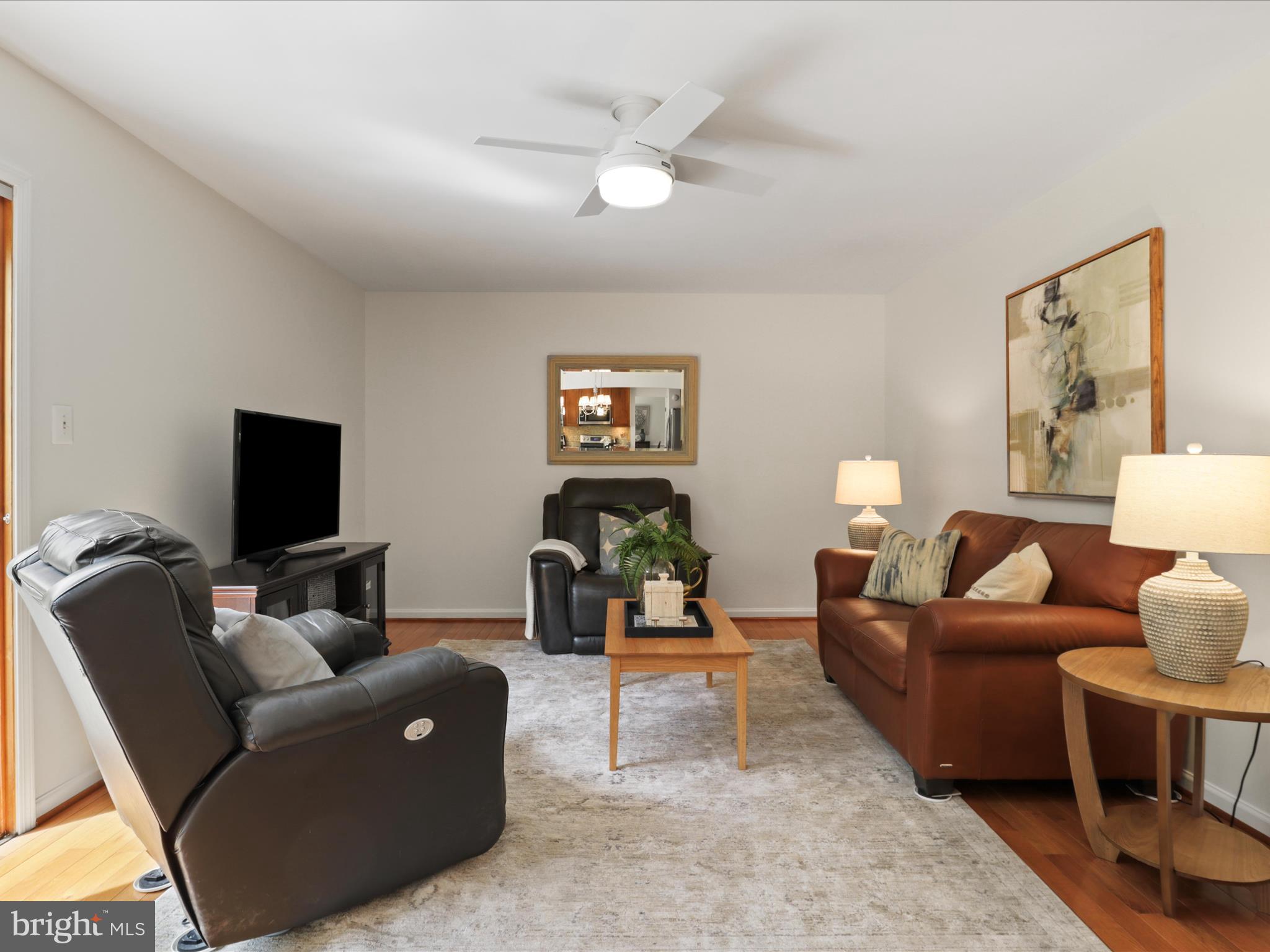12021 Heather Down Drive Herndon, VA 20170 - Photo 13 of 47 a living room with furniture and a flat screen tv