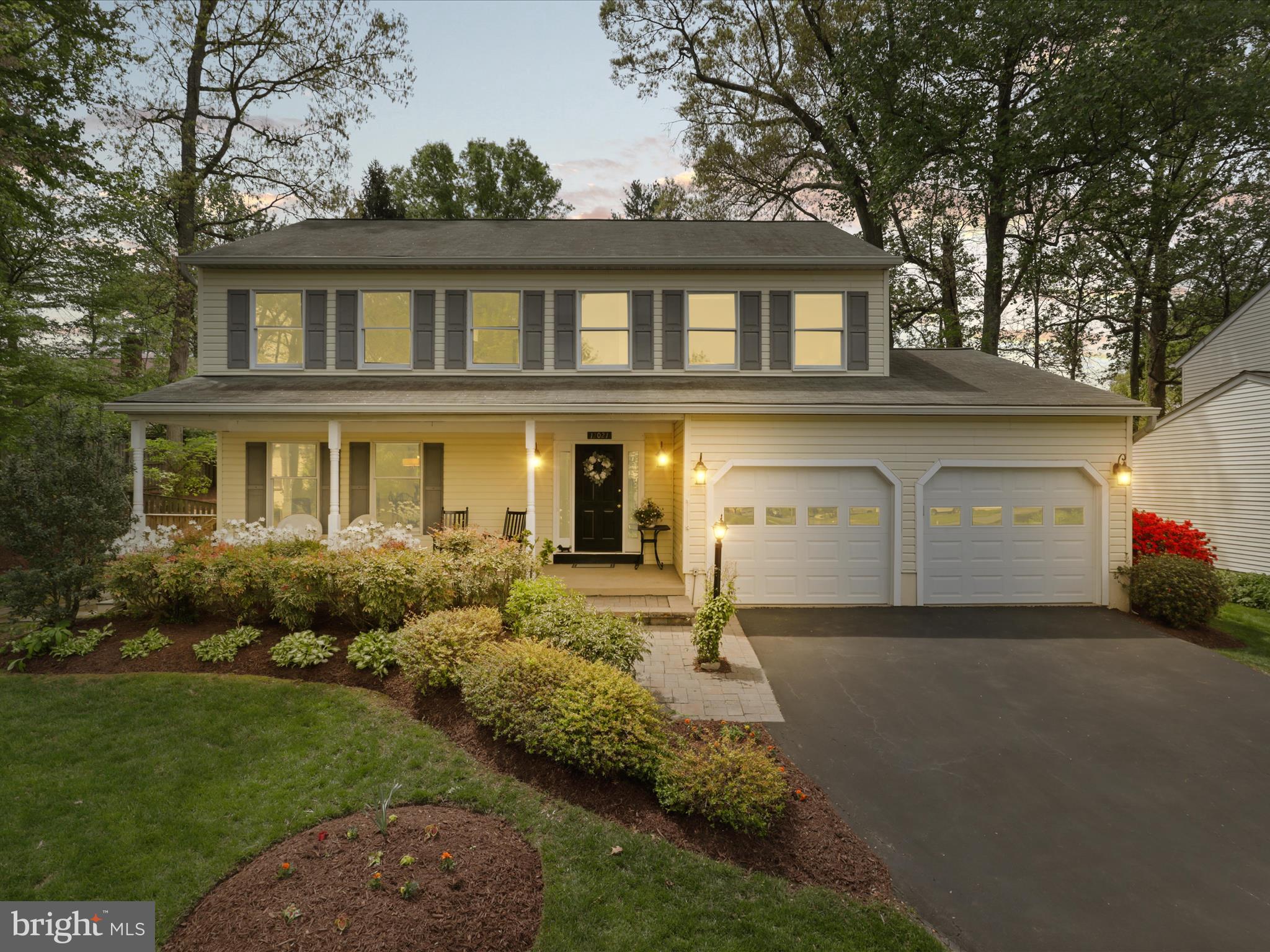 12021 Heather Down Drive Herndon, VA 20170 - Photo 2 of 47 a front view of a house with garden