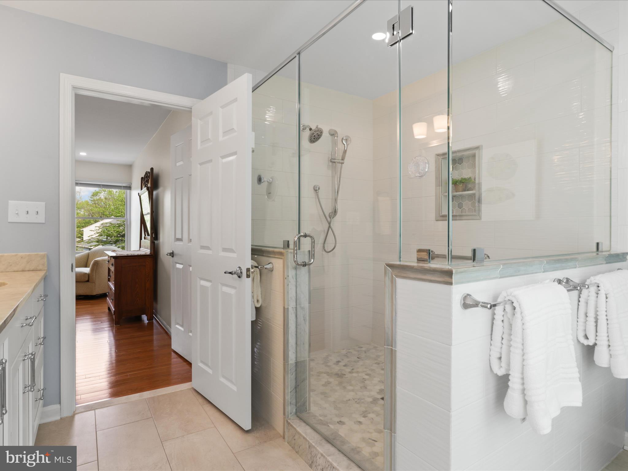 12021 Heather Down Drive Herndon, VA 20170 - Photo 27 of 47 a en suite bathroom with a shower and a sink