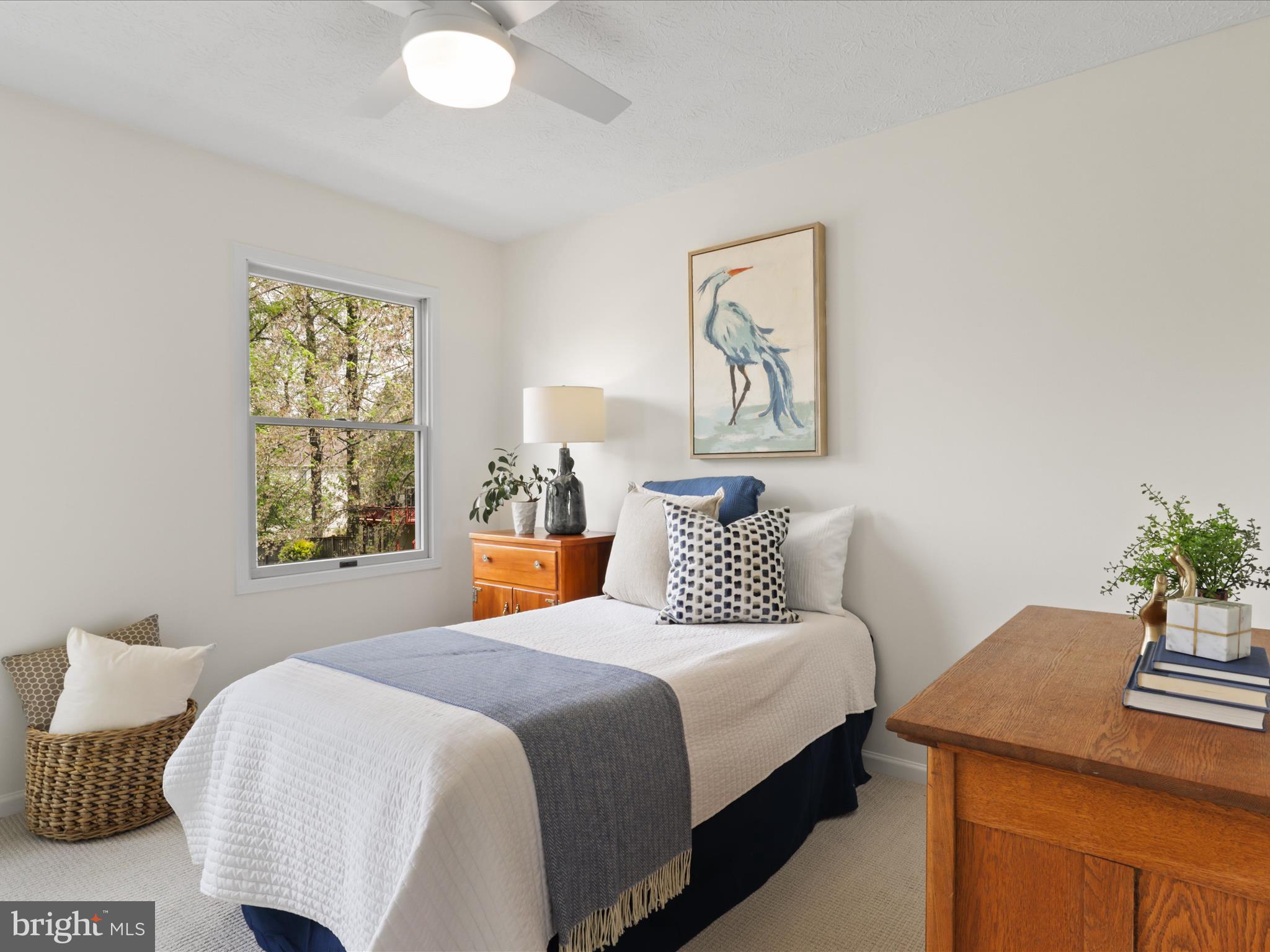 12021 Heather Down Drive Herndon, VA 20170 - Photo 29 of 47 a bedroom with a bed and a table in it