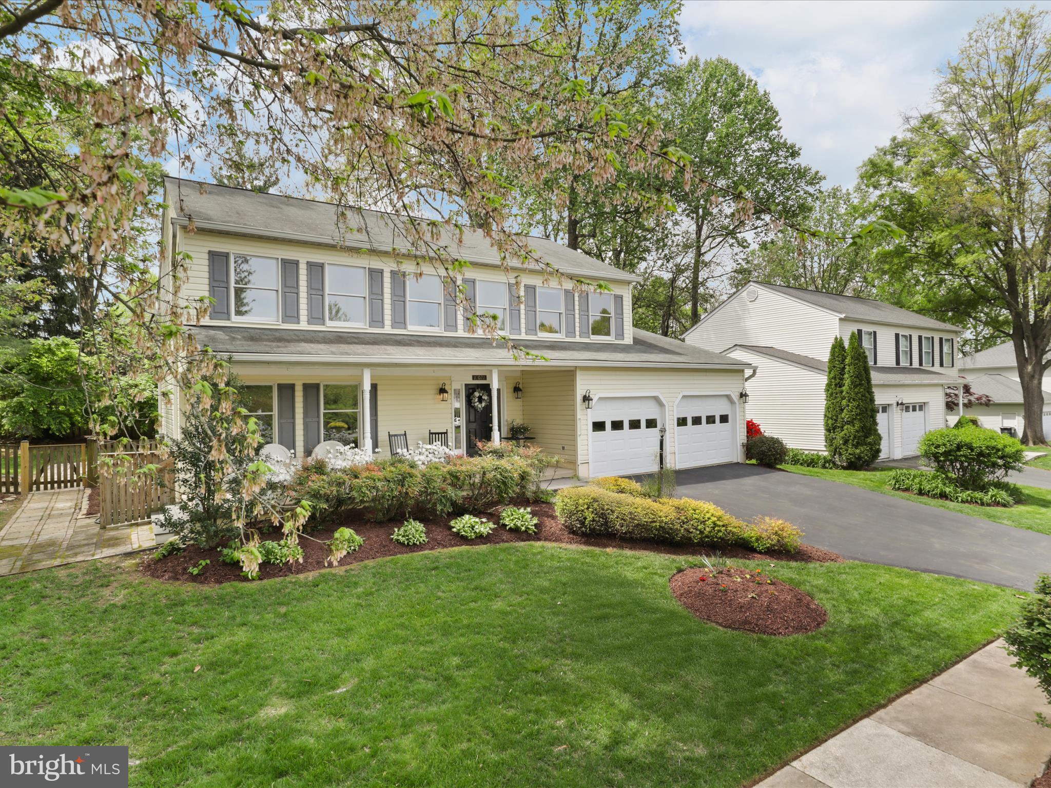 12021 Heather Down Drive Herndon, VA 20170 - Photo 3 of 47 a front view of a house with garden