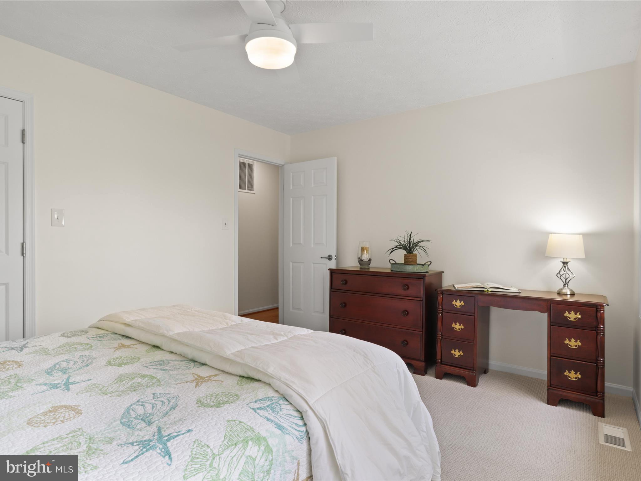 12021 Heather Down Drive Herndon, VA 20170 - Photo 32 of 47 a bedroom with a bed and a dresser