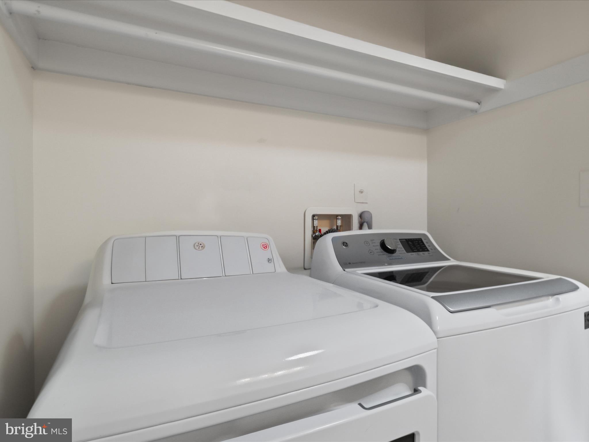 12021 Heather Down Drive Herndon, VA 20170 - Photo 34 of 47 a utility room with dryer and washer