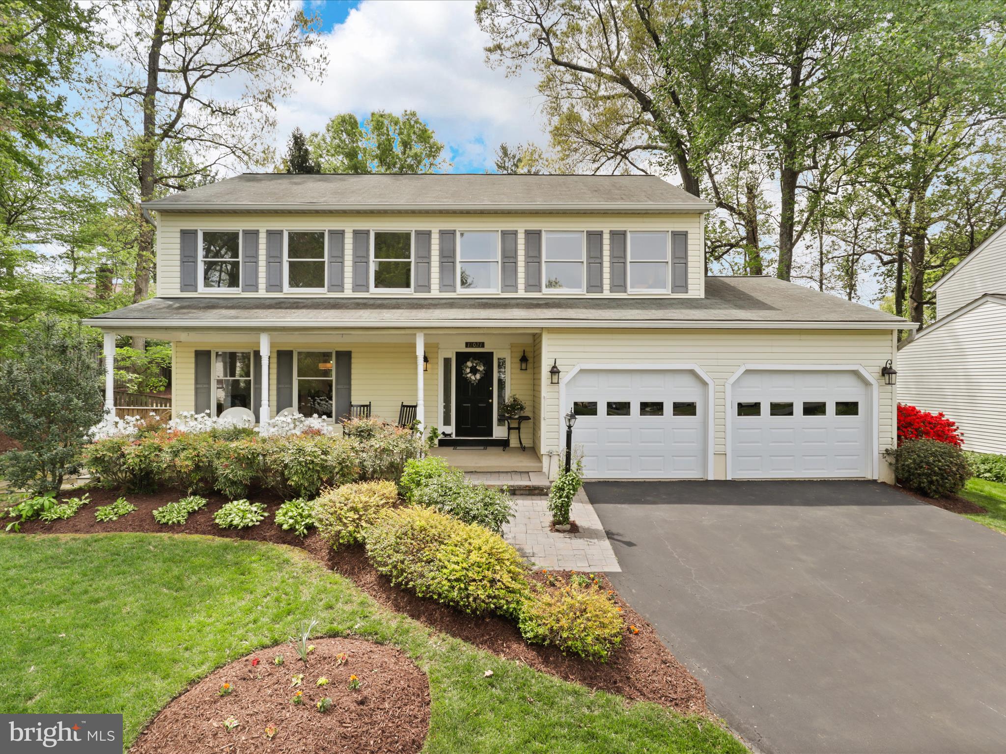 12021 Heather Down Drive Herndon, VA 20170 - Photo 4 of 47 a front view of a house with garden