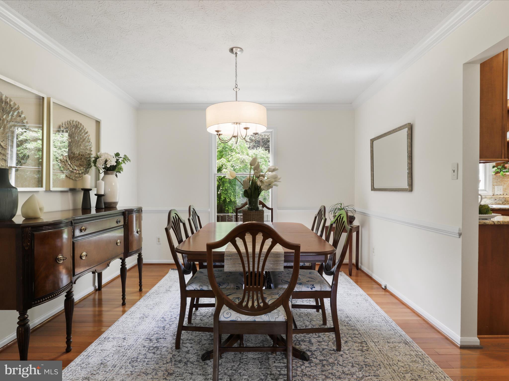 12021 Heather Down Drive Herndon, VA 20170 - Photo 9 of 47 a view of a dining room with furniture window and wooden floor