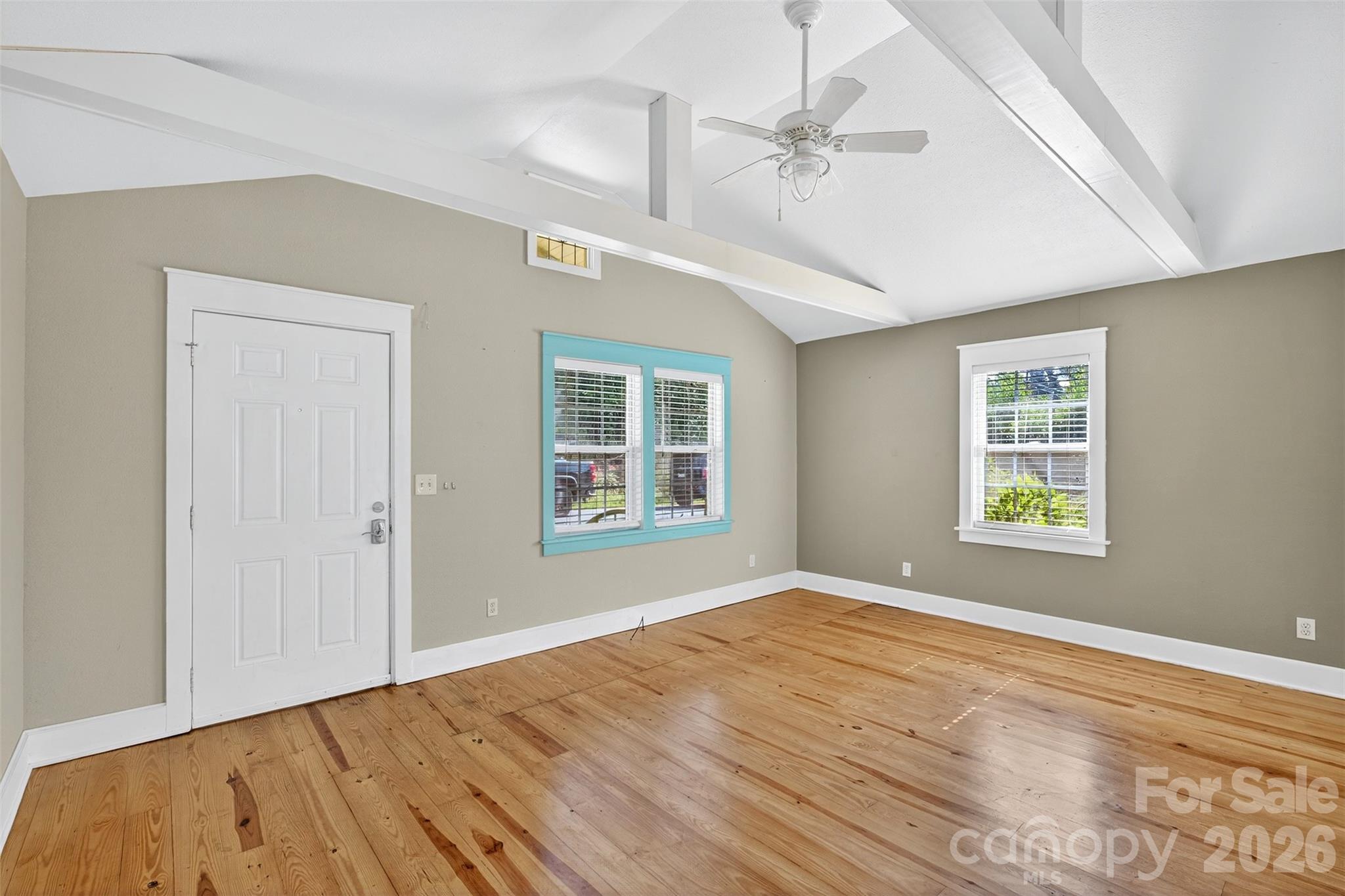 160 East Howard Street Tryon, NC 28782 - Photo 11 of 48 a view of empty room with wooden floor and fan
