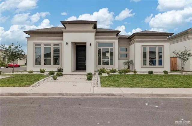 front view of a house with a yard