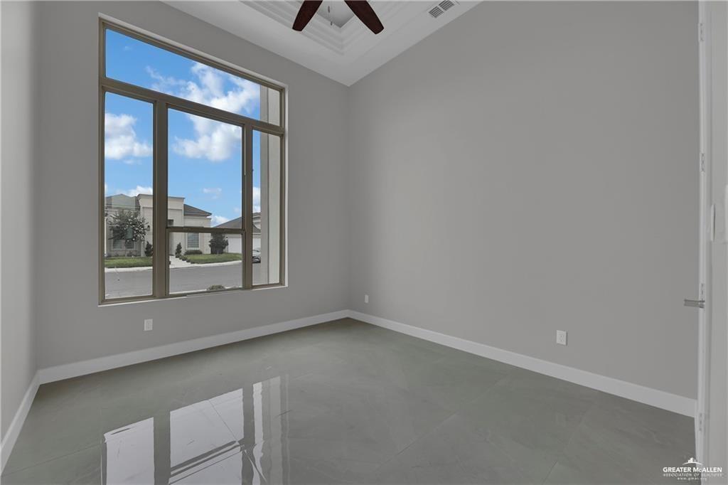 2516 Viola Street Mission, TX 78574 - Photo 14 of 17 Spare room with baseboards and a ceiling fan