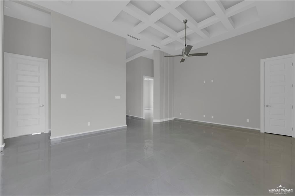 2516 Viola Street Mission, TX 78574 - Photo 5 of 17 Spare room with coffered ceiling, beamed ceiling, and dark tile patterned flooring