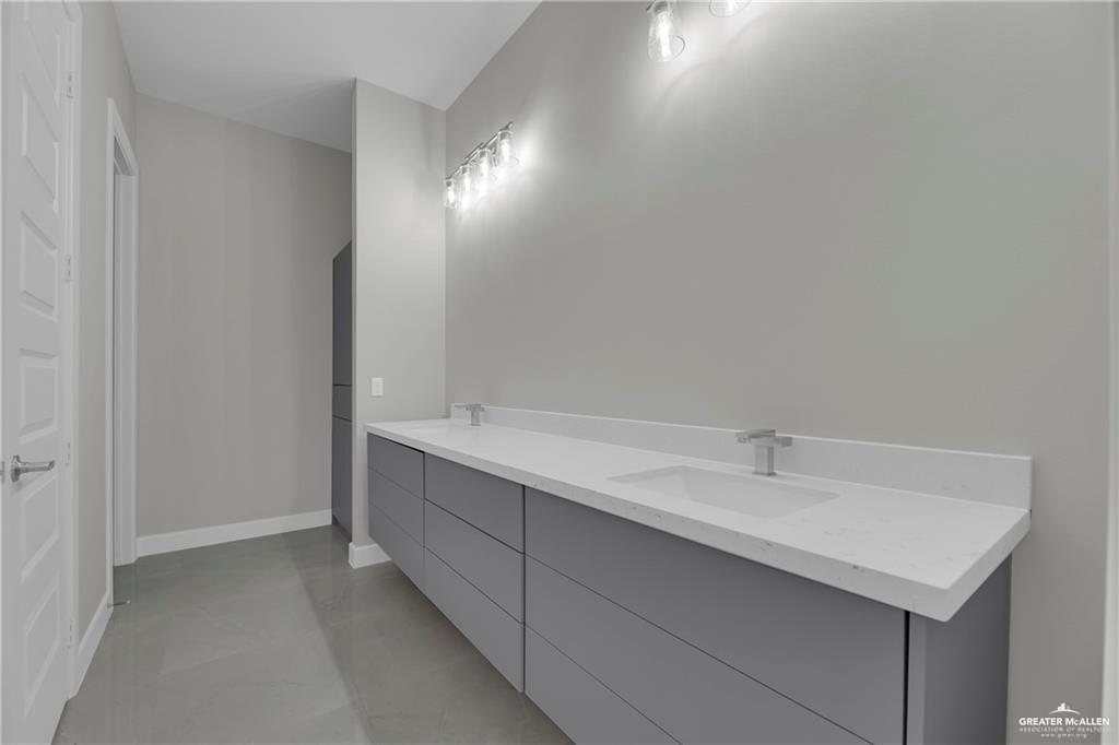 2516 Viola Street Mission, TX 78574 - Photo 9 of 17 Bathroom featuring double vanity and concrete floors