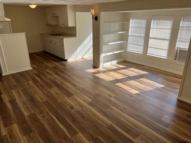 a view of a hardwood floor in a kitchen