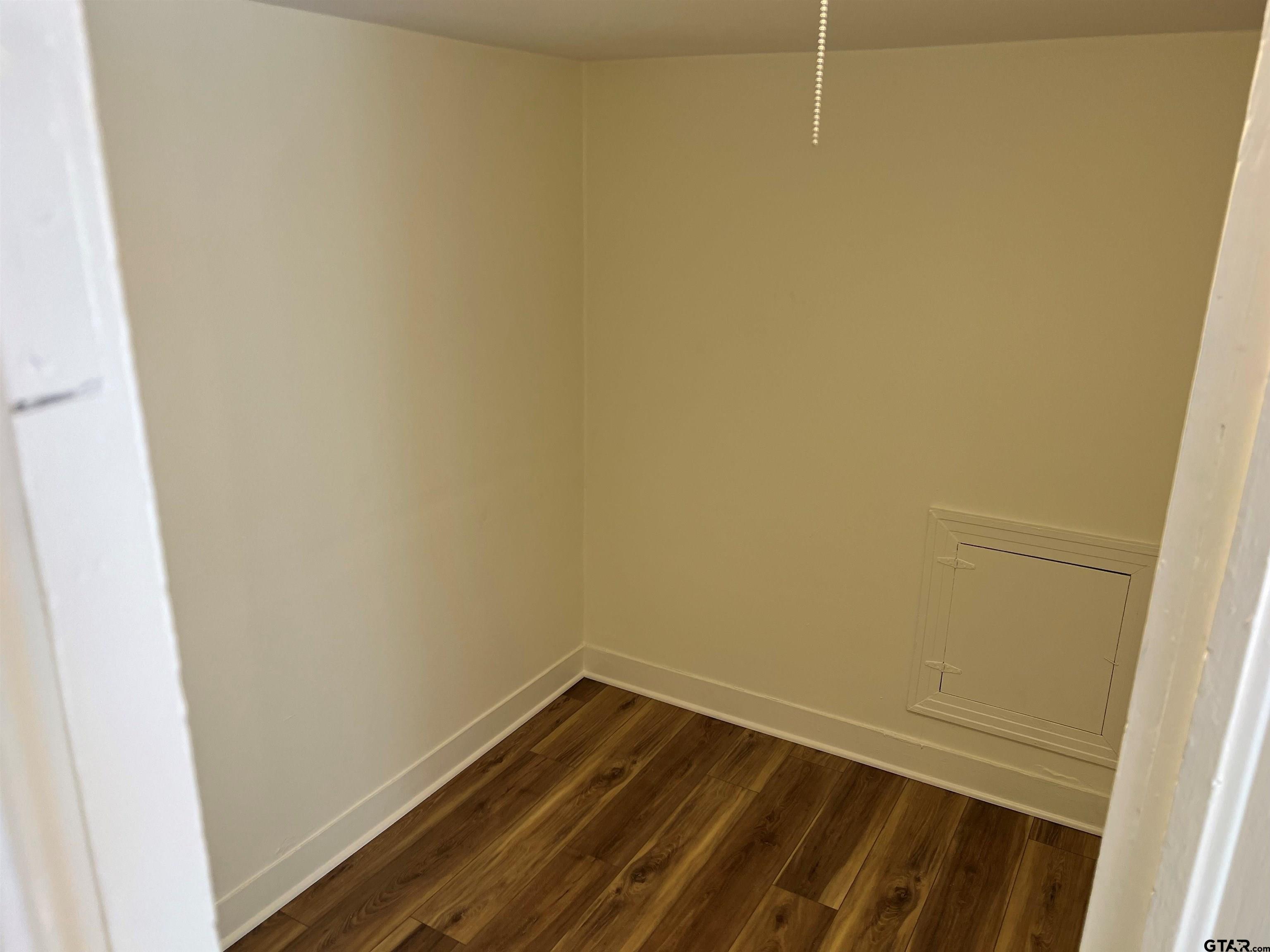 219 Wells Street, Unit C Tyler, TX 75701 - Photo 6 of 8 a view of wooden floor