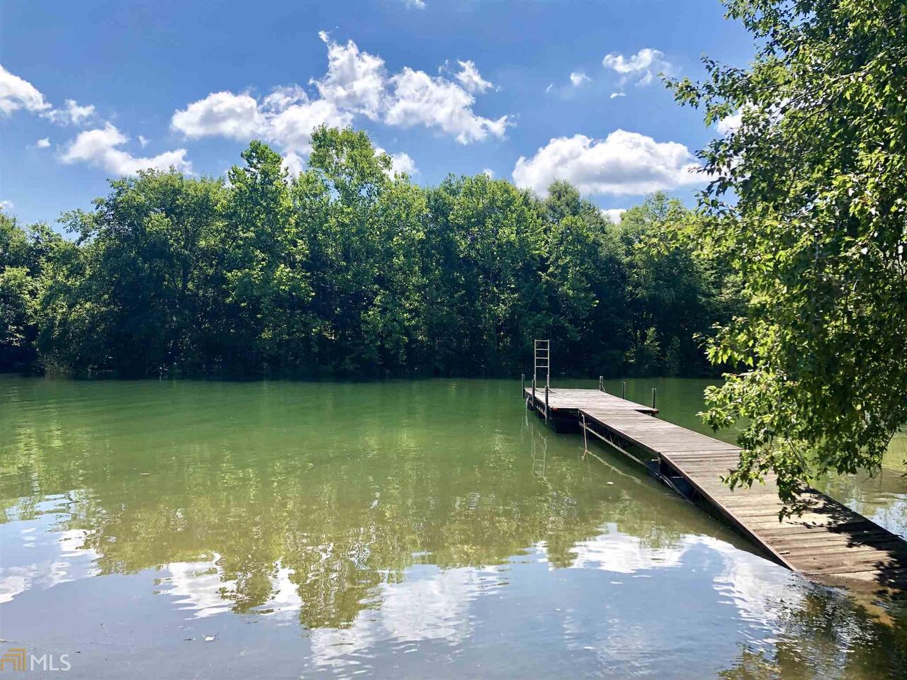 a view of a swimming pool with a yard