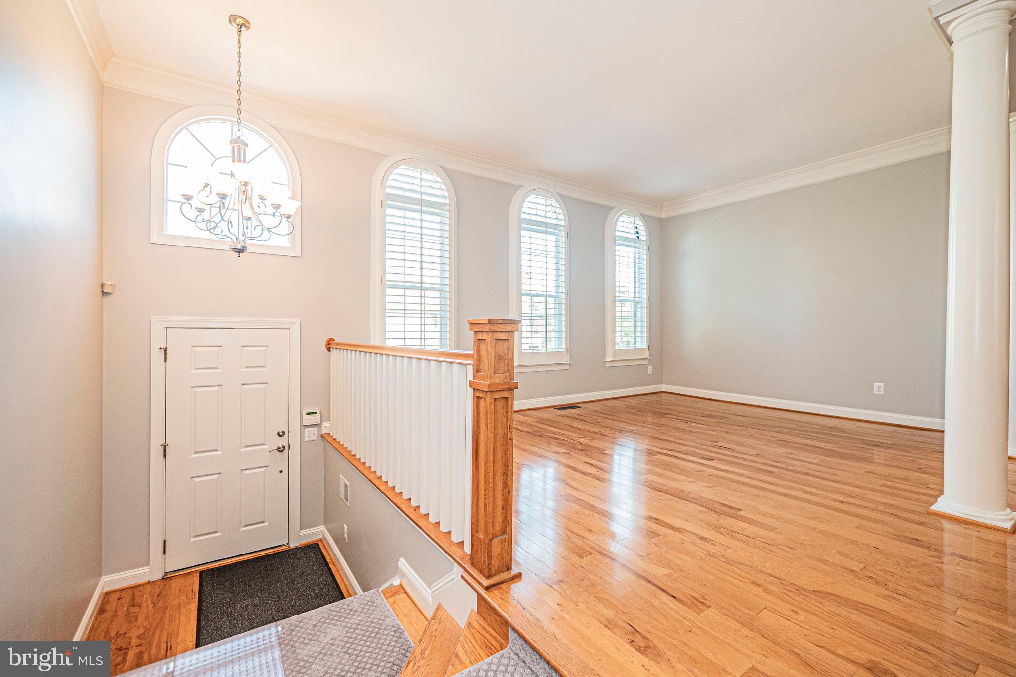 5448 Edsall Ridge Place Alexandria, VA 22312 - Photo 3 of 52 a view of a room with wooden floor and window