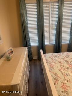 433 West Avenue, Unit 1 Ocean City, NJ 08226 - Photo 13 of 29 a spacious bedroom with a bed and wooden floor
