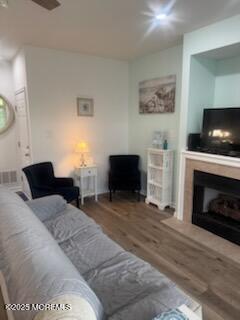 433 West Avenue, Unit 1 Ocean City, NJ 08226 - Photo 14 of 29 a living room with furniture a flat screen tv and a fireplace