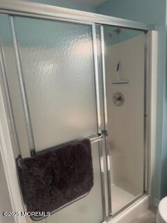 433 West Avenue, Unit 1 Ocean City, NJ 08226 - Photo 15 of 29 a bathroom with a glass shower door
