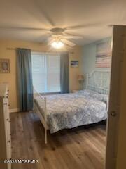 433 West Avenue, Unit 1 Ocean City, NJ 08226 - Photo 27 of 29 a bedroom with a bed and a night stand