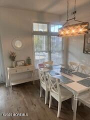 433 West Avenue, Unit 1 Ocean City, NJ 08226 - Photo 3 of 29 a dining room with furniture and window