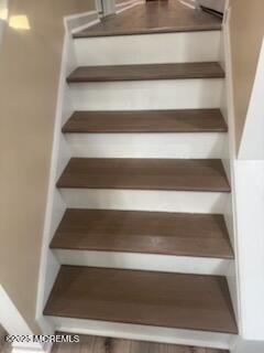 433 West Avenue, Unit 1 Ocean City, NJ 08226 - Photo 4 of 29 a view of walk in closet with empty racks