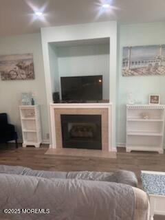433 West Avenue, Unit 1 Ocean City, NJ 08226 - Photo 10 of 29 a living room with a fireplace and a flat screen tv