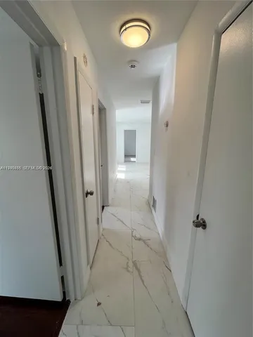 a bathroom with a sink a mirror and a toilet