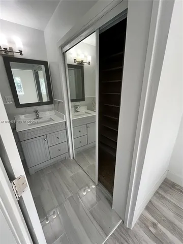 a view of a yard with wooden fence