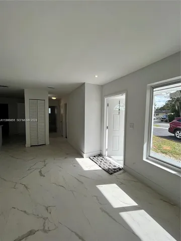 a view of an empty room and window