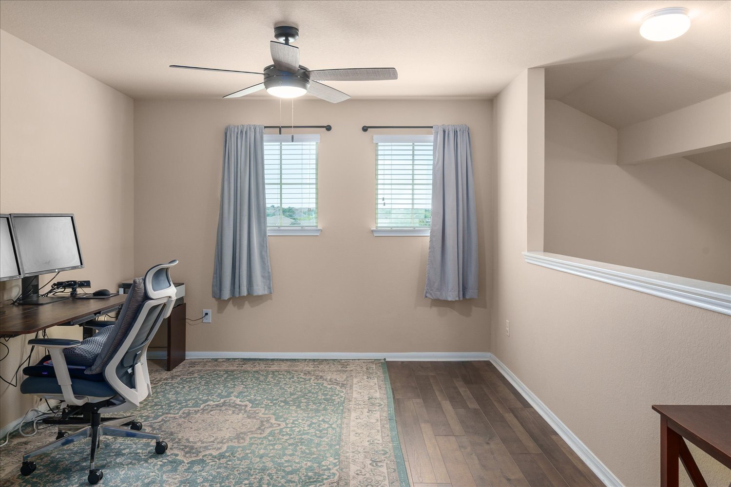 717 Kaluga Trail Leander, TX 78641 - Photo 19 of 40 a view of a workspace with furniture and a window