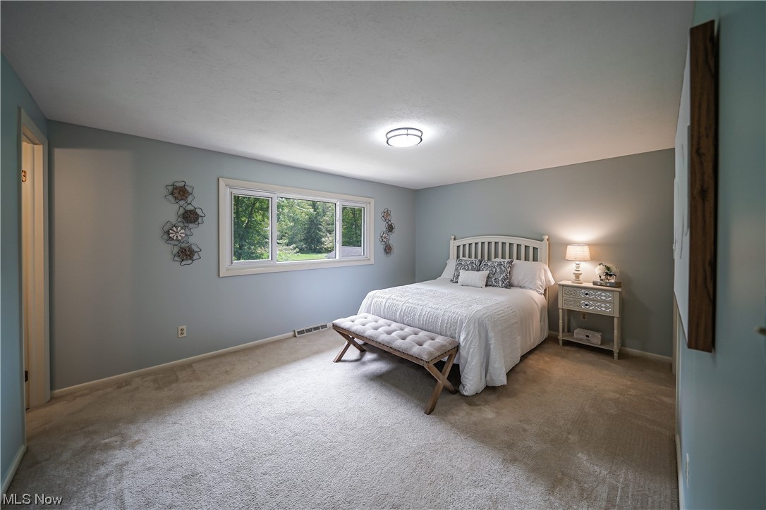 1198 Winchell Road Aurora, OH 44202 - Photo 7 of 28 master bedroom with full bathroom.