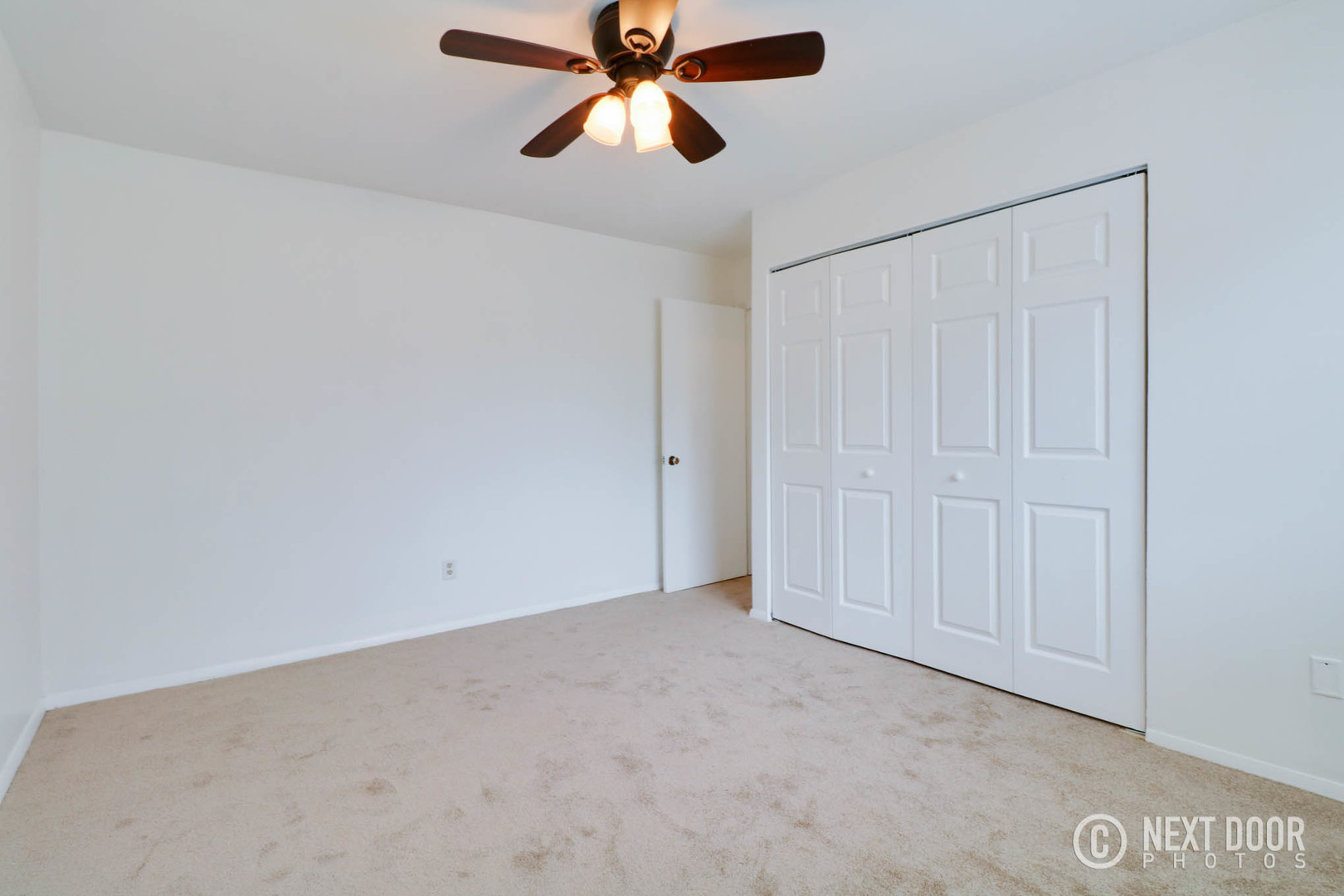 159 Heathgate Road Montgomery, IL 60538 - Photo 12 of 21 an empty room with windows and fan