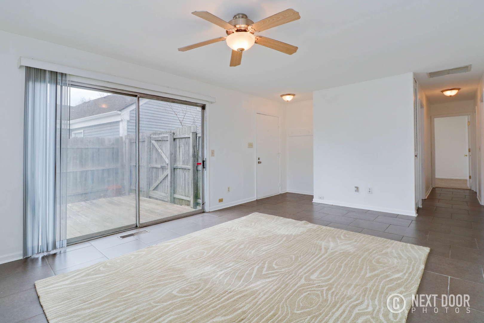 159 Heathgate Road Montgomery, IL 60538 - Photo 6 of 21 a view of empty room with wooden floor and fan