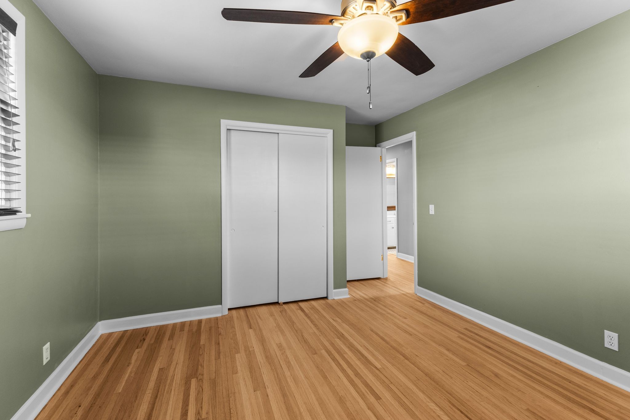 6411 Ranchero Drive Nashville, TN 37209 - Photo 12 of 34 an empty room with a hardwood and a ceiling fan
