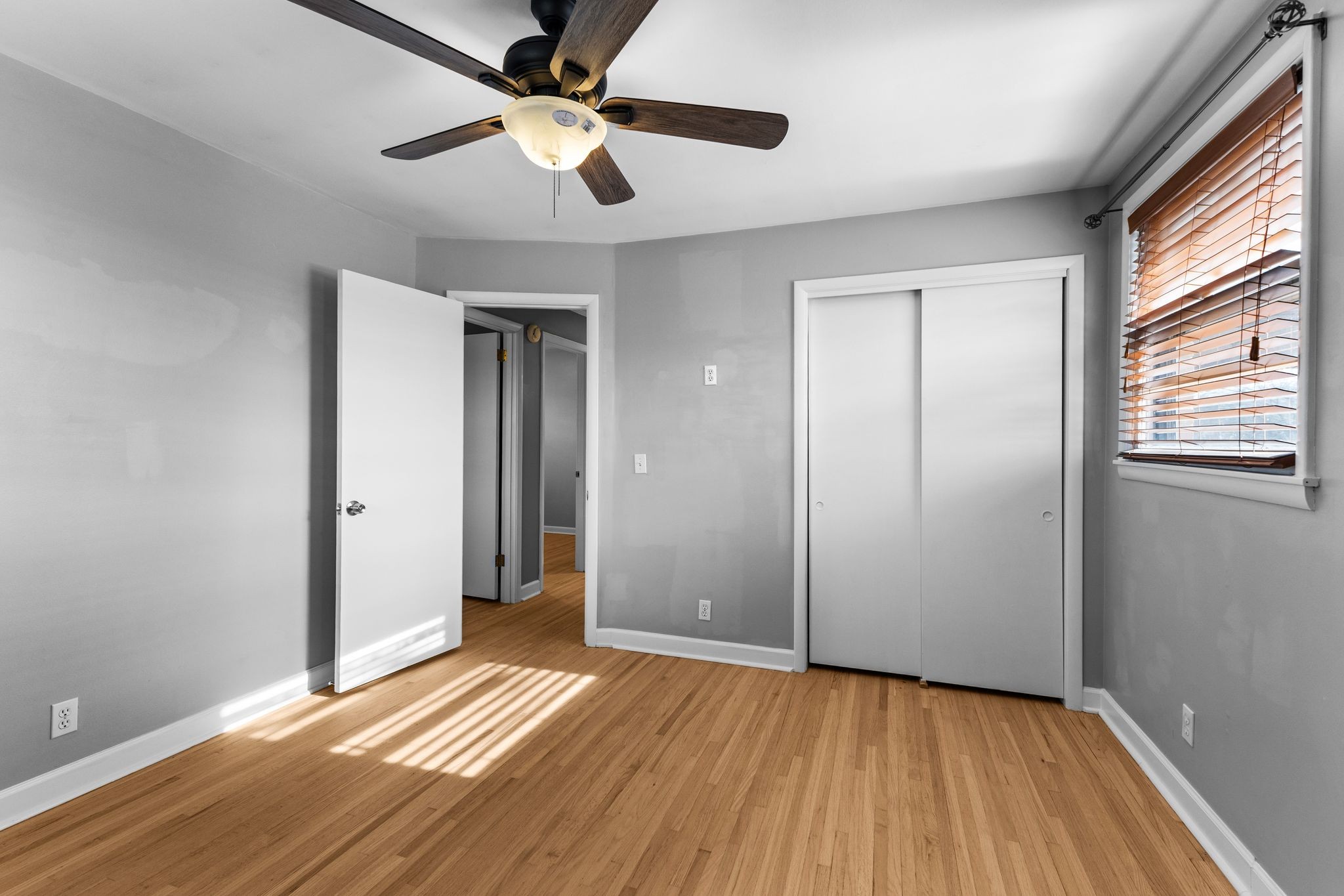 6411 Ranchero Drive Nashville, TN 37209 - Photo 14 of 34 an empty room with wooden floor a ceiling fan and closet
