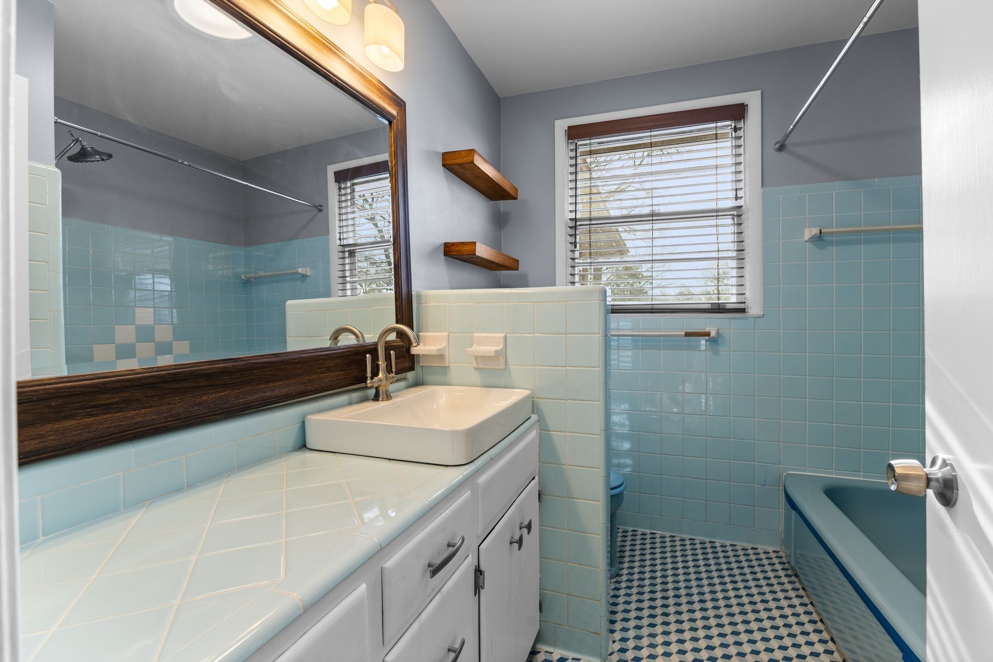 6411 Ranchero Drive Nashville, TN 37209 - Photo 17 of 34 a bathroom with a sink a toilet and a mirror