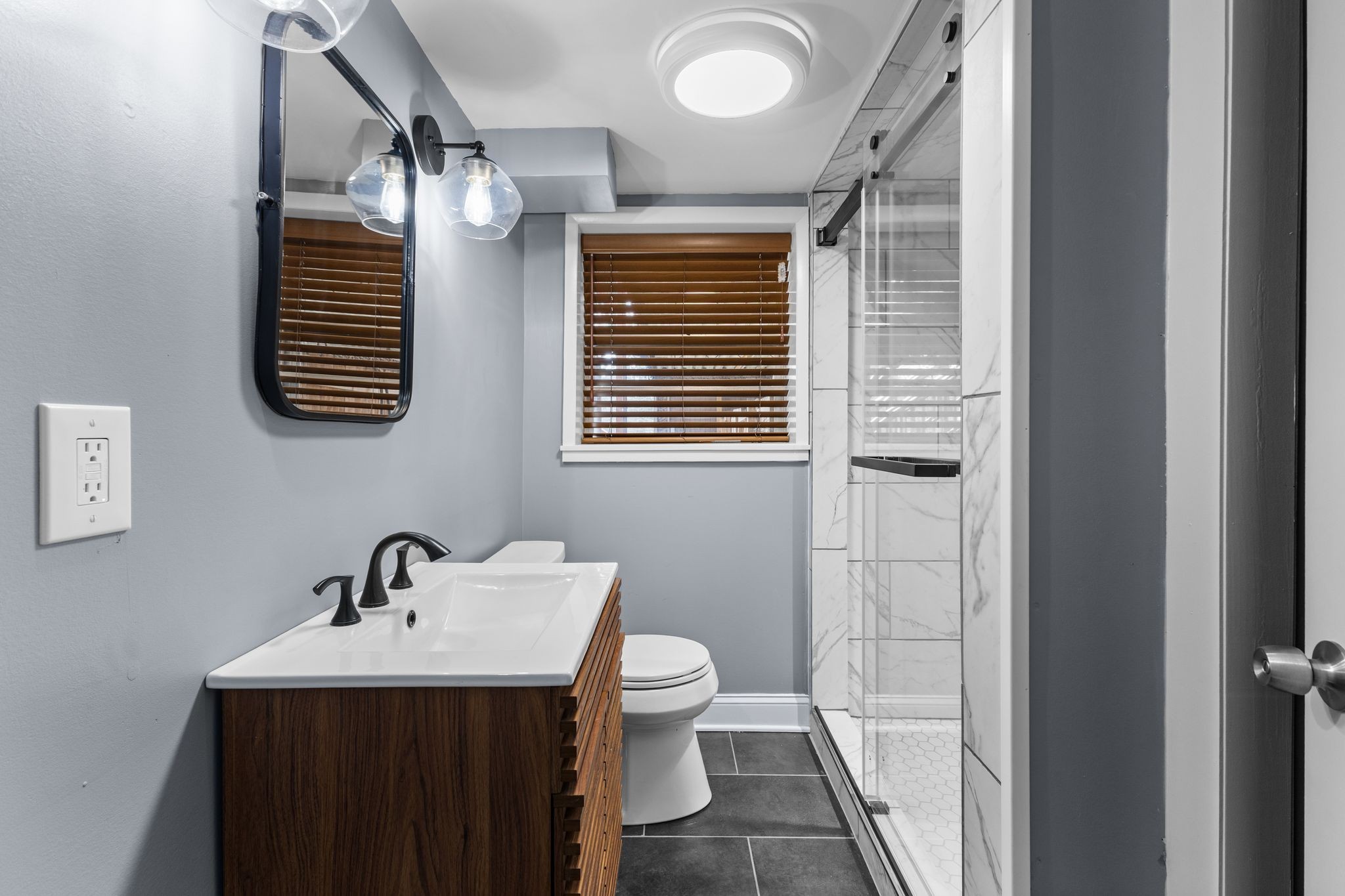 6411 Ranchero Drive Nashville, TN 37209 - Photo 21 of 34 a bathroom with a sink a toilet and shower